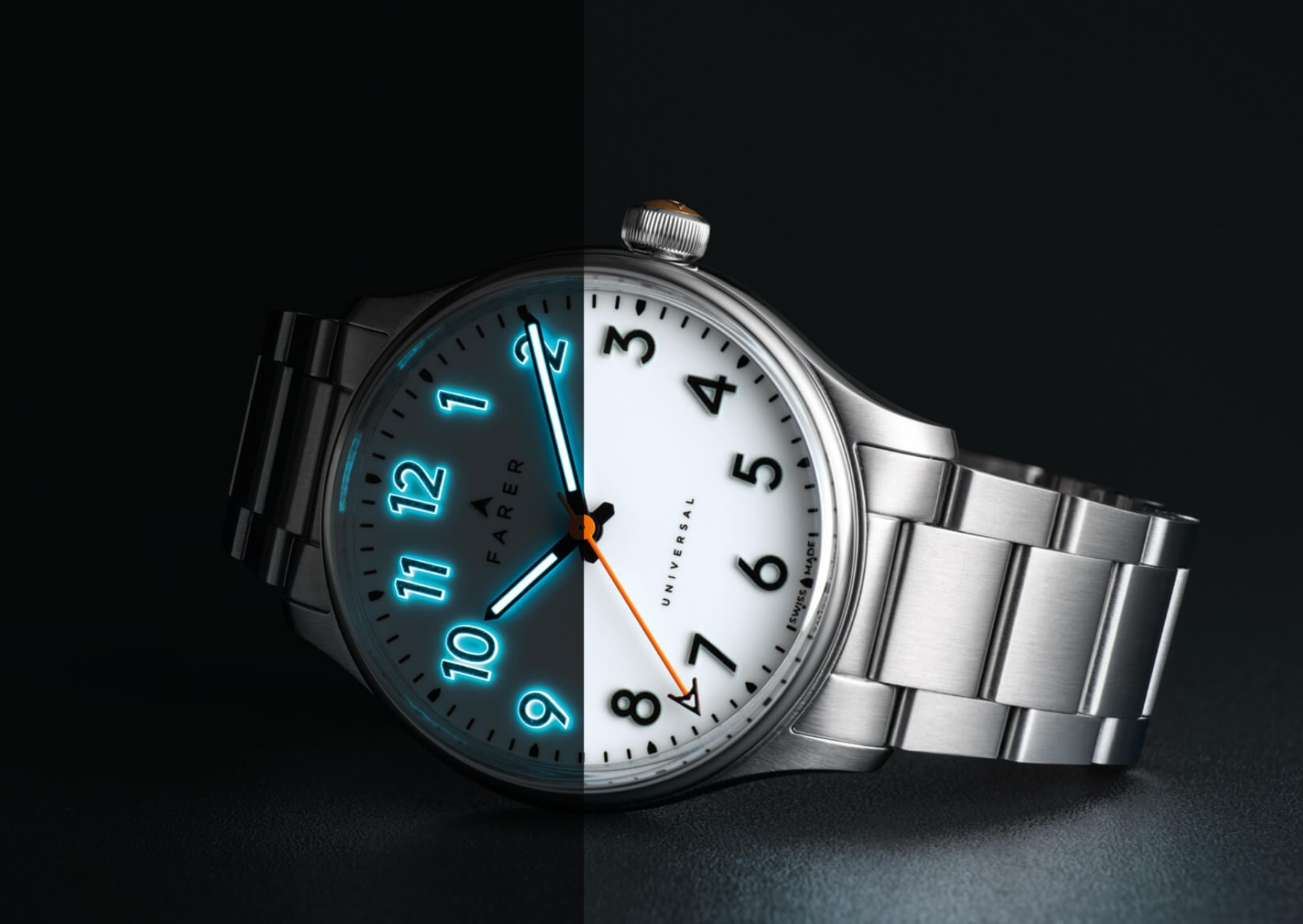Farer Resolute III with stainless steel bracelet displaying blue lume on dial and hands