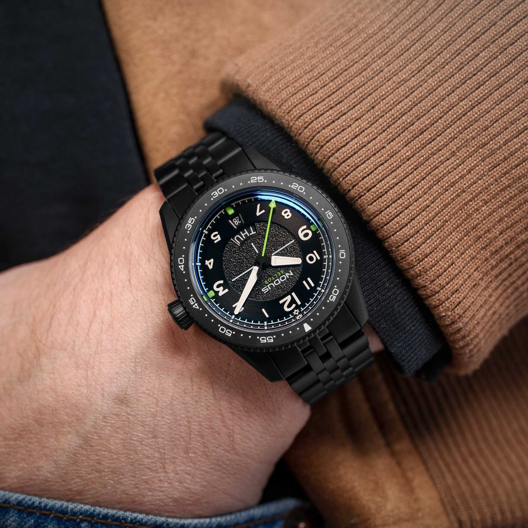 Nodus Sector II Pilot DLC watch on wrist with matte black case and neon green accents