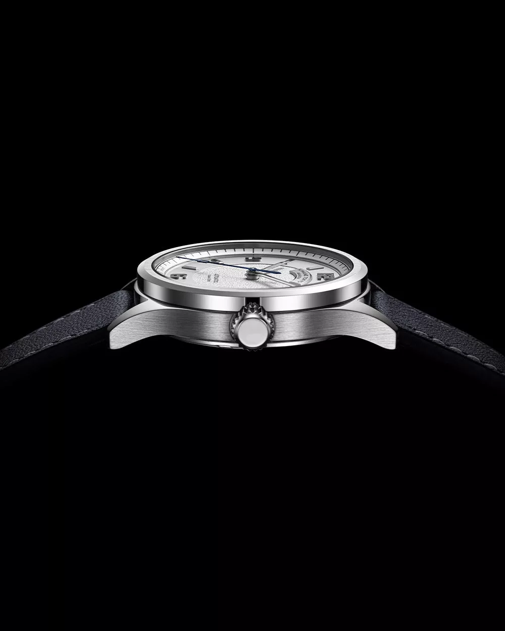 Side profile of Kiwame Tokyo Iwao automatic watch showing slim stainless steel case and signed crown