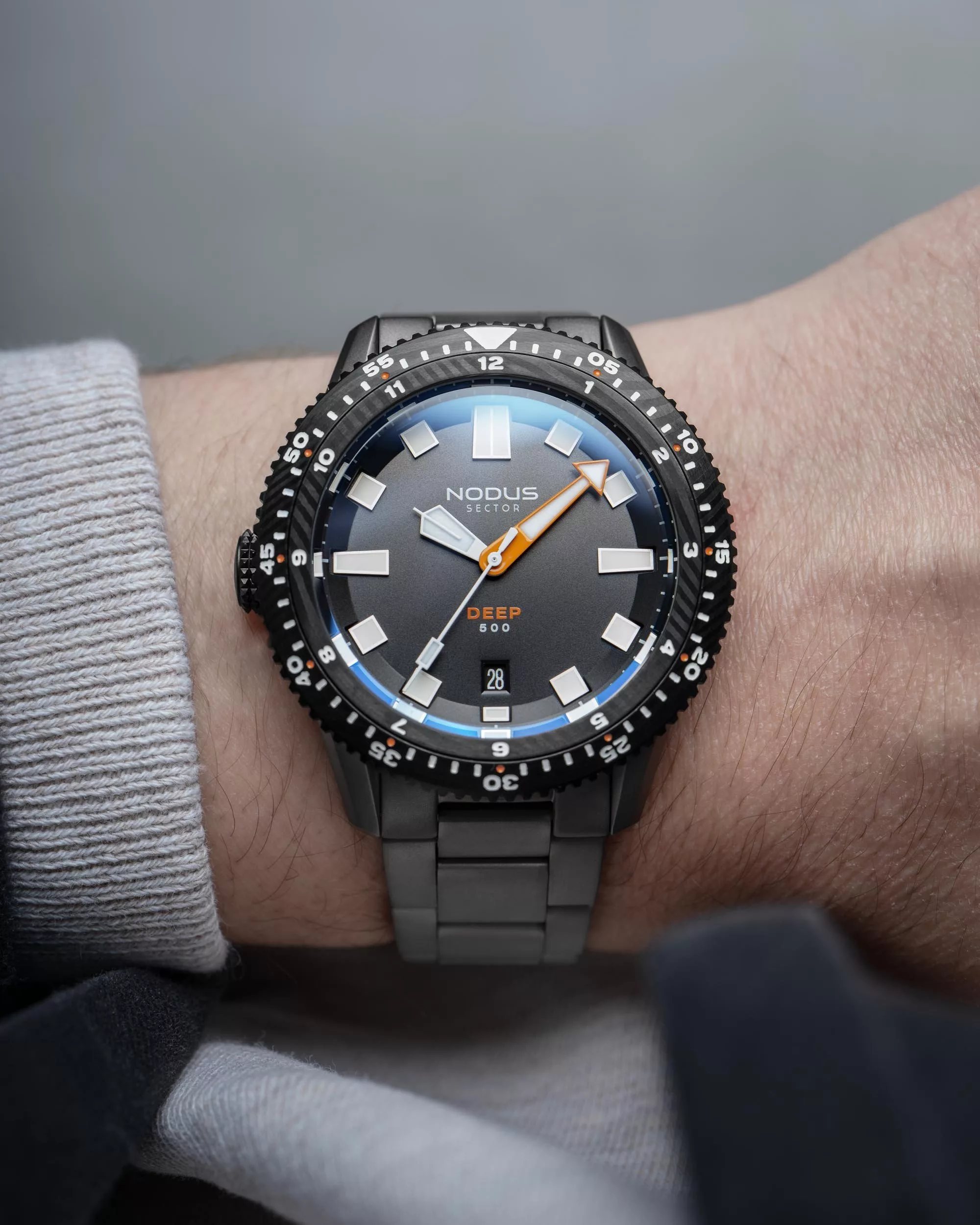 Nodus Sector Deep Damascus on wrist
