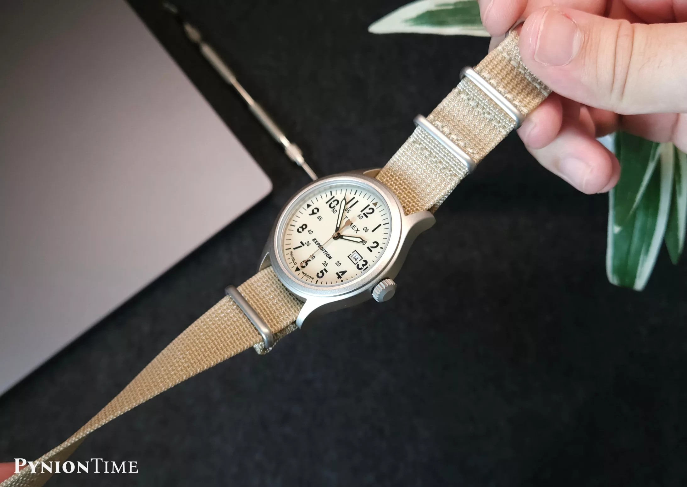 The Timex Expedition TW4B30100 comes with a cream dial using both 12-hour and 24-hour markings