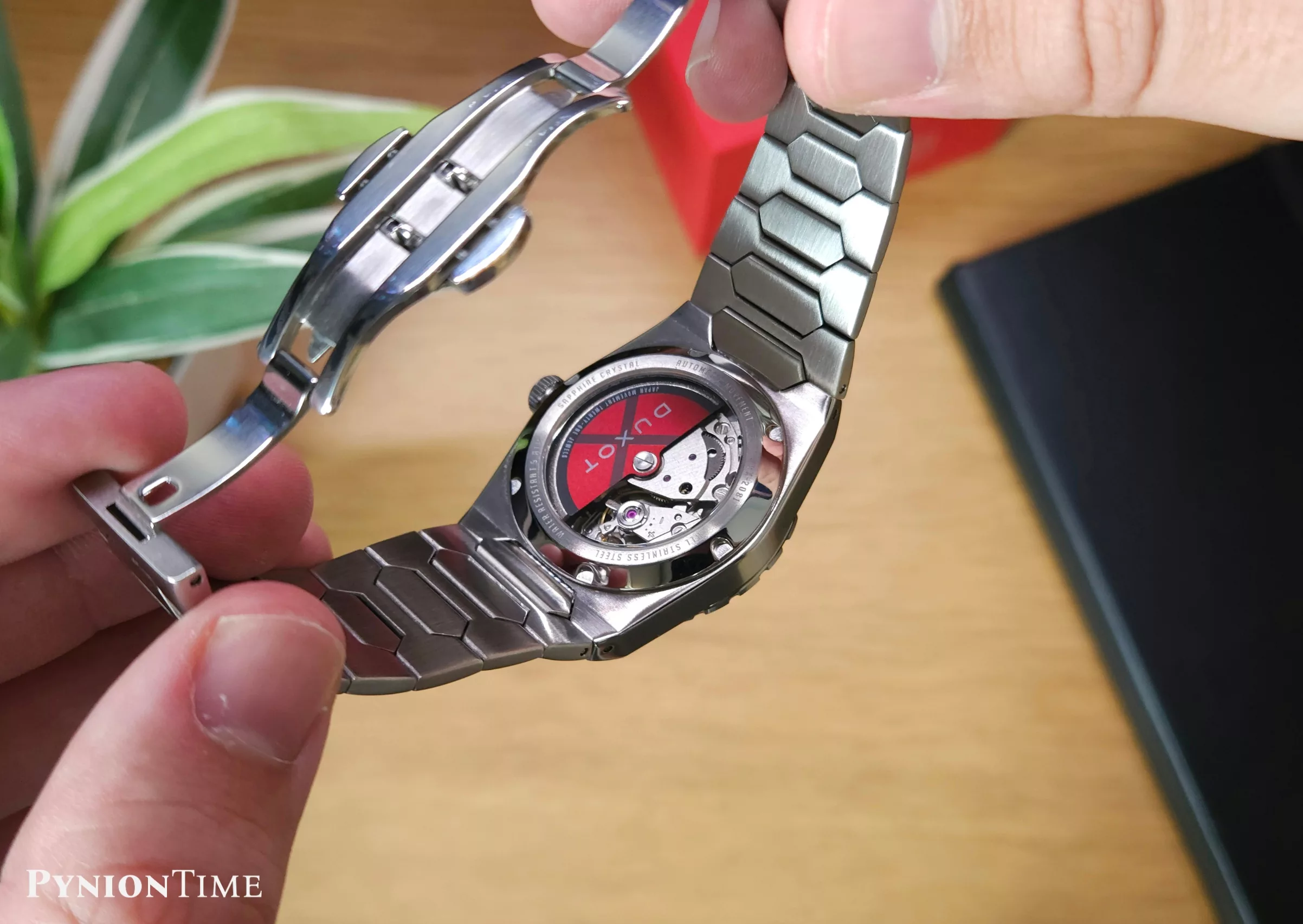 It comes with a decorated rotor, visible through the exhibition caseback