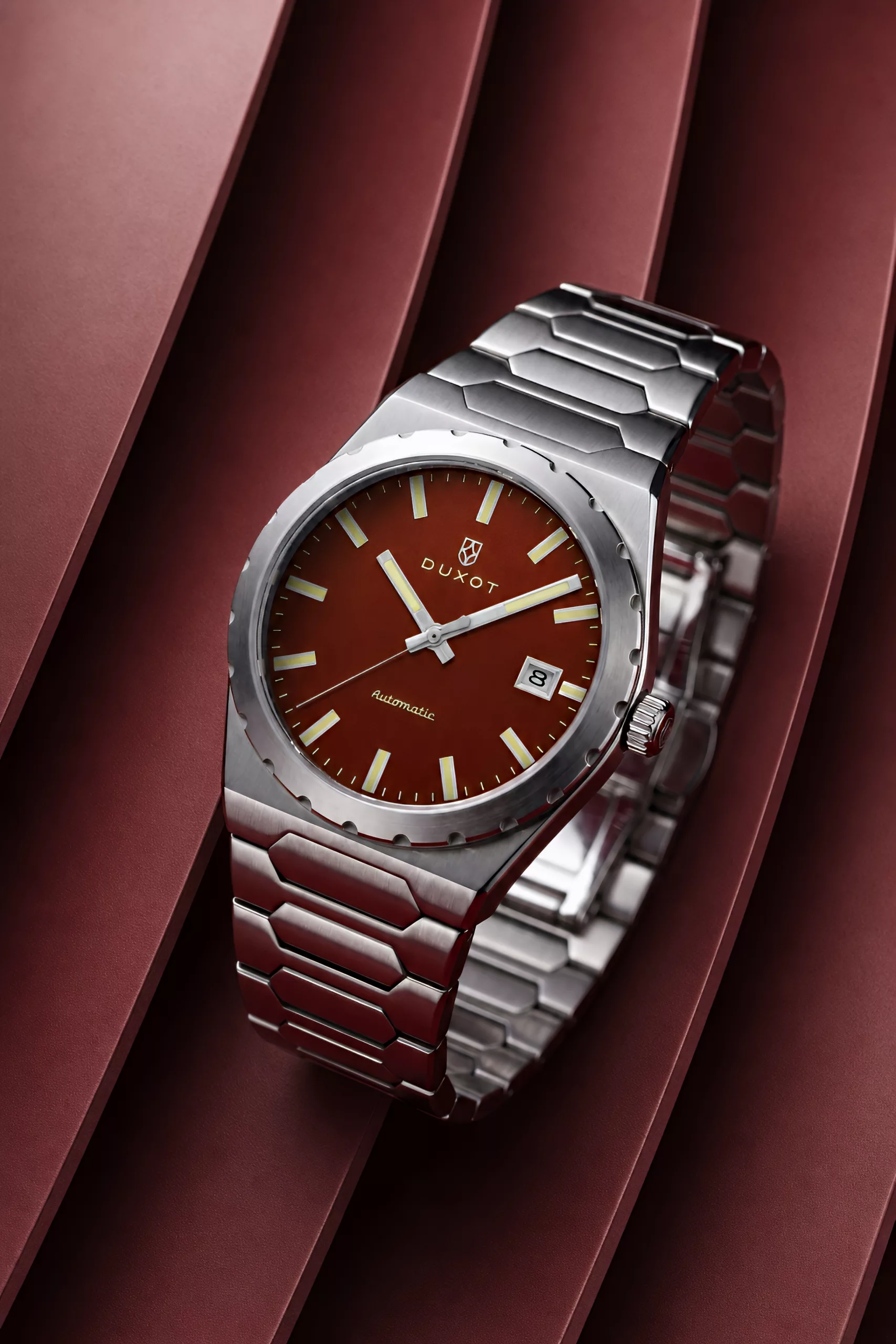 The Taranto uses a pull-out crown, keeping the case profile simple rather than screw-down sealed
