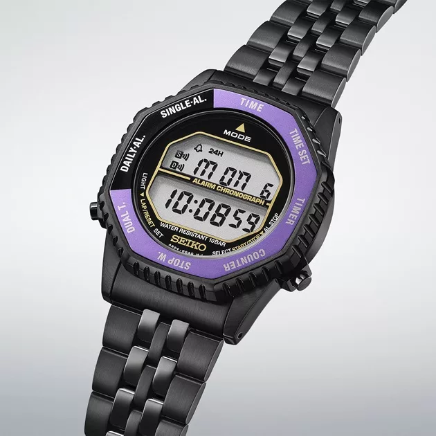 It has a rotary switch that cycles through the alarm, timer, and stopwatch without a dedicated pusher