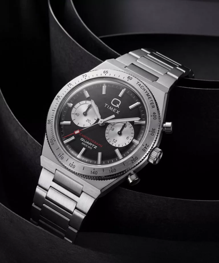 The Q Timex Continental Chronograph 36mm has a fixed tachymeter bezel, replacing the rotating bezel of the 40mm original