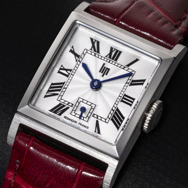 The Lip Churchill C18's signature double sunburst dial and faceted blue hands