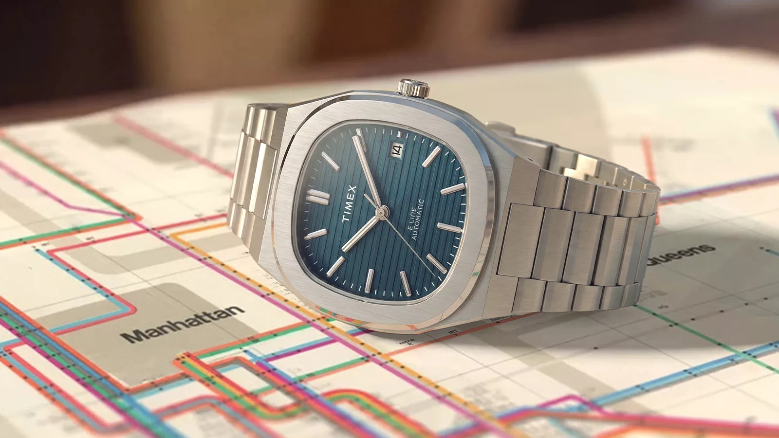 It features a horizontally textured “garage door” dial styled after the Patek Philippe Nautilus