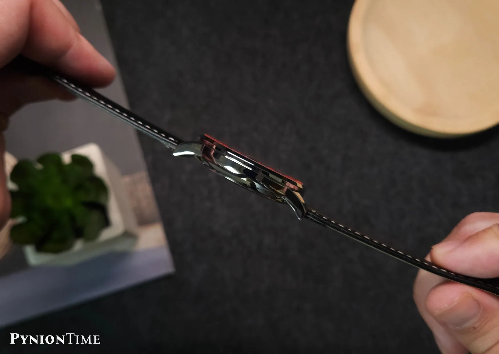 Side profile of the NEAT Autumn Ember showing the 9.5mm polished case