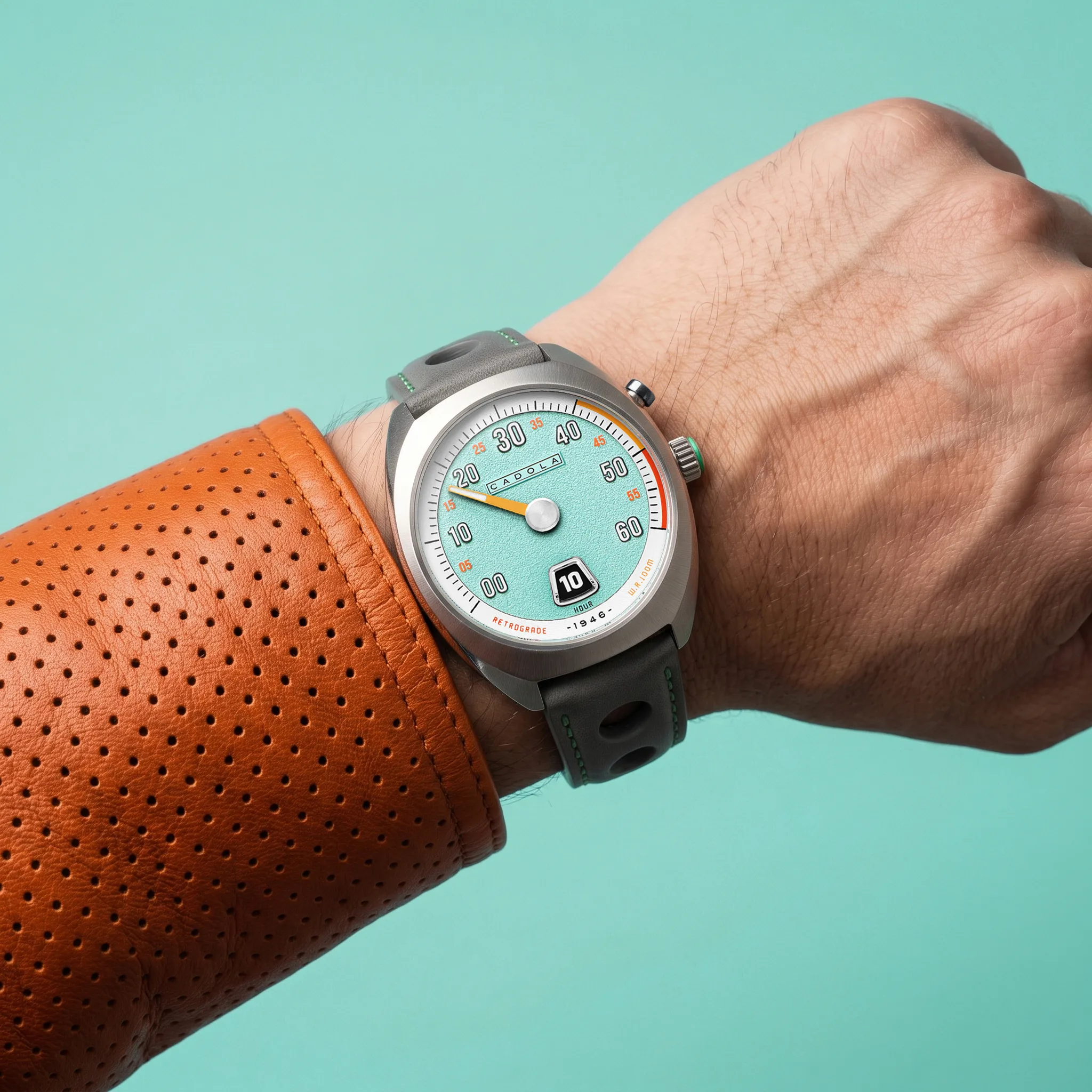 The Teal Touch, reference CD-1066-02, has a pale mint dial and an orange minute hand