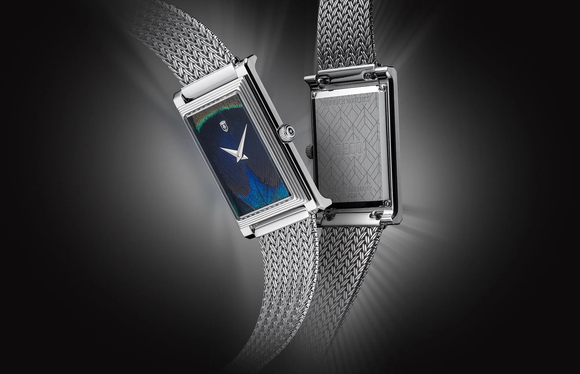 It features a genuine peacock feather dial that shifts between blue, turquoise and green