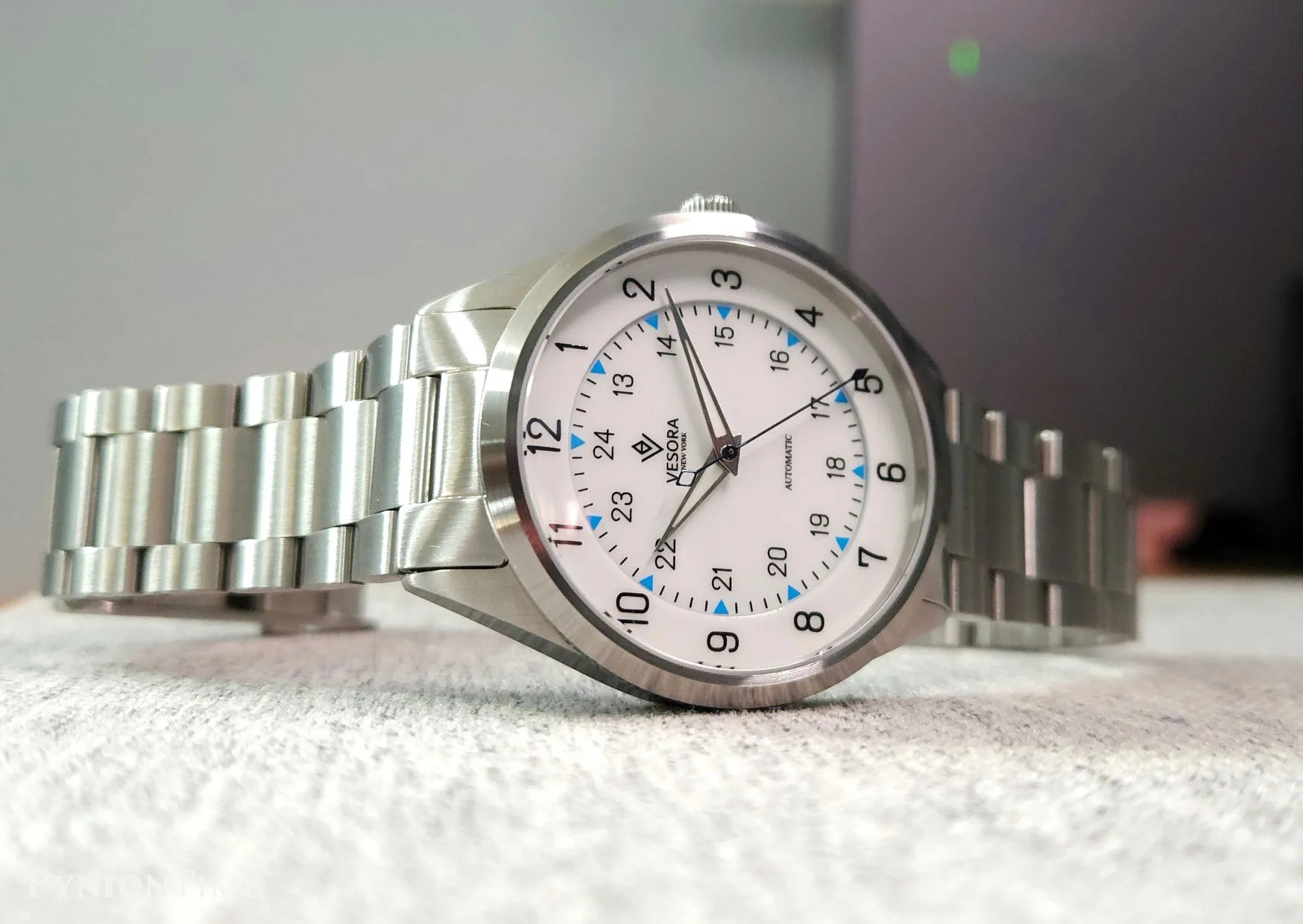 Front view of the double-layer enamel dial with its recessed sector and blue triangles